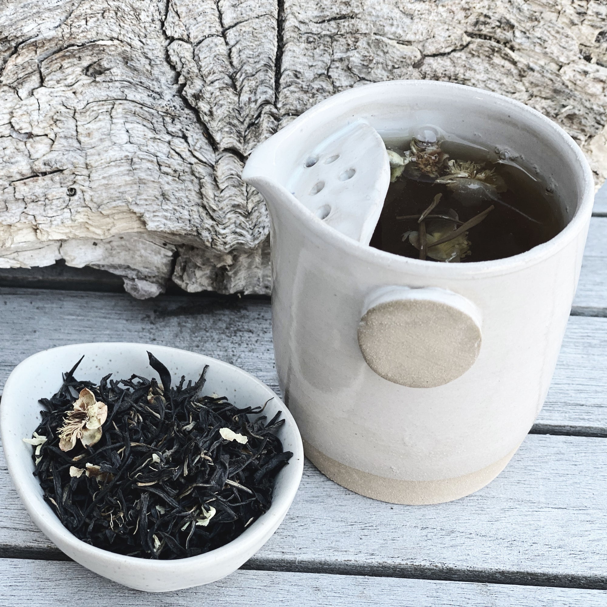 Tea brewing in ceramic jug